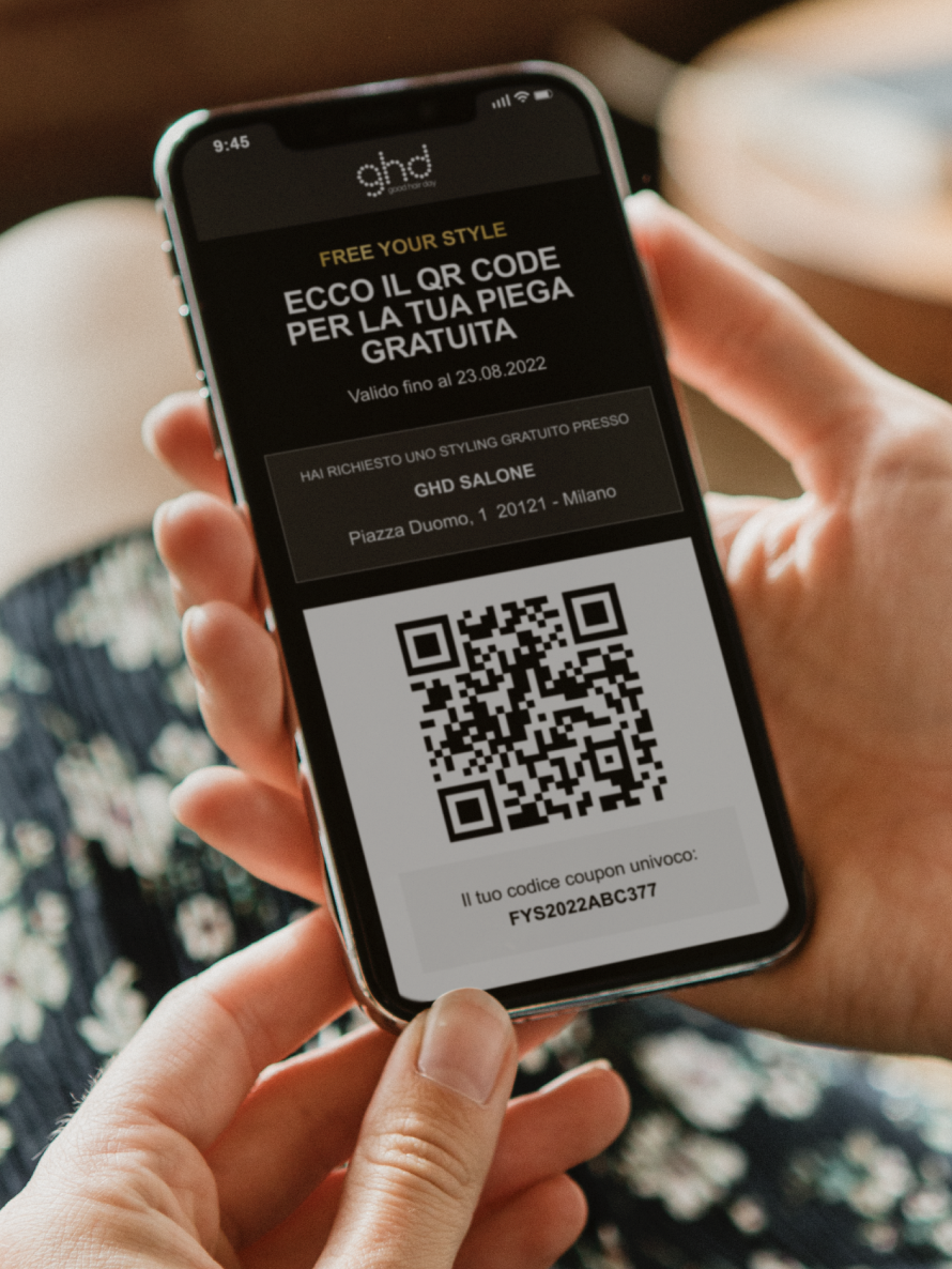 A smartphone showing the QR code scan for new "Free Your Style" service. Dynamo and Caffeina for ghd.